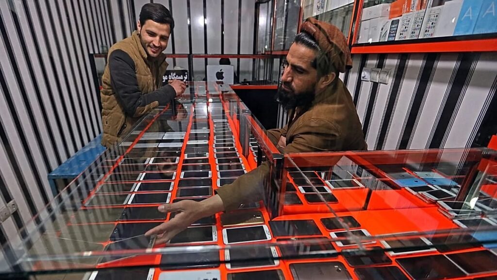 Afghan government staff told to abandon smartphones or face prison