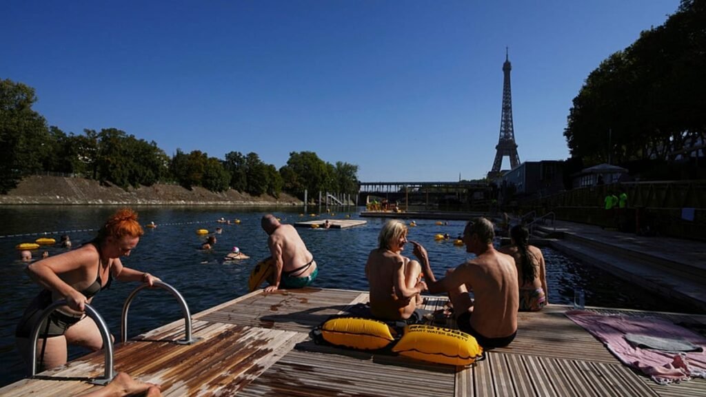 Paris invites locals to cool off in canal during 40C heatwave