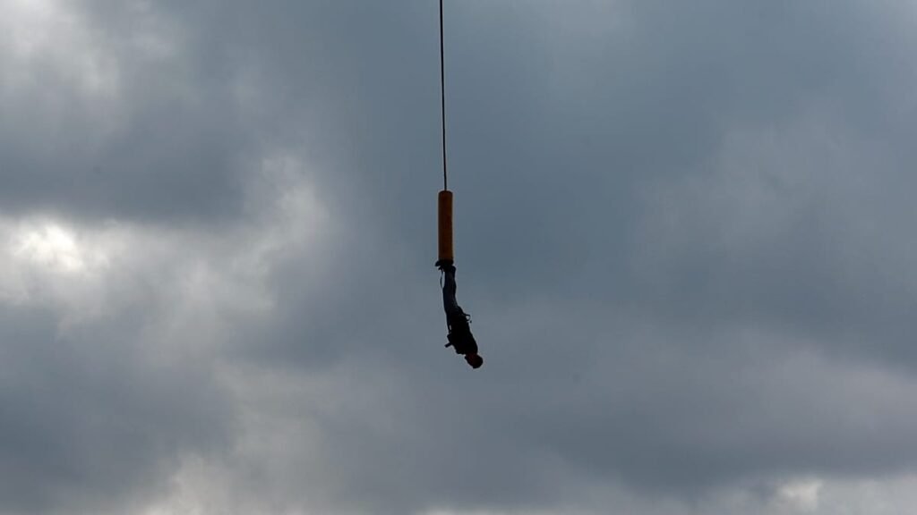 Young woman dies after being launched off bridge without safety rope