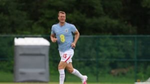England’s Burn swaps football boots for cowboy boots during break between games