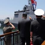 North Korea’s Kim unveils plans for 10,000-ton warships, nuclear navy