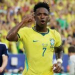Vinicius fires Brazil into World Cup knockouts with 3-0 win over Scotland