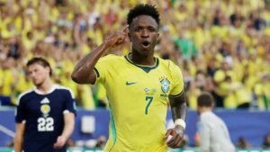 Vinicius fires Brazil into World Cup knockouts with 3-0 win over Scotland