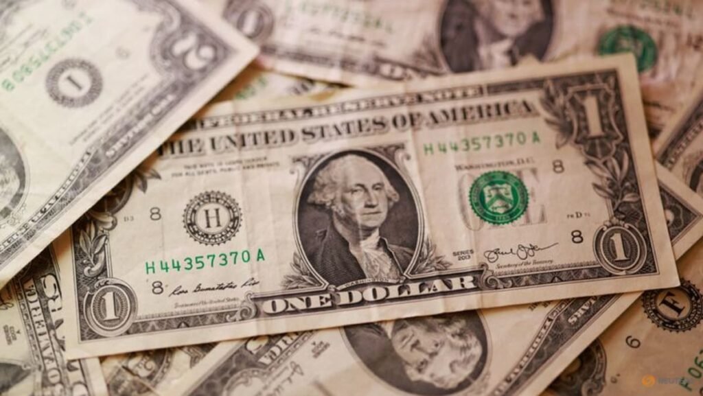 Dollar eases from 13-month high after data burst