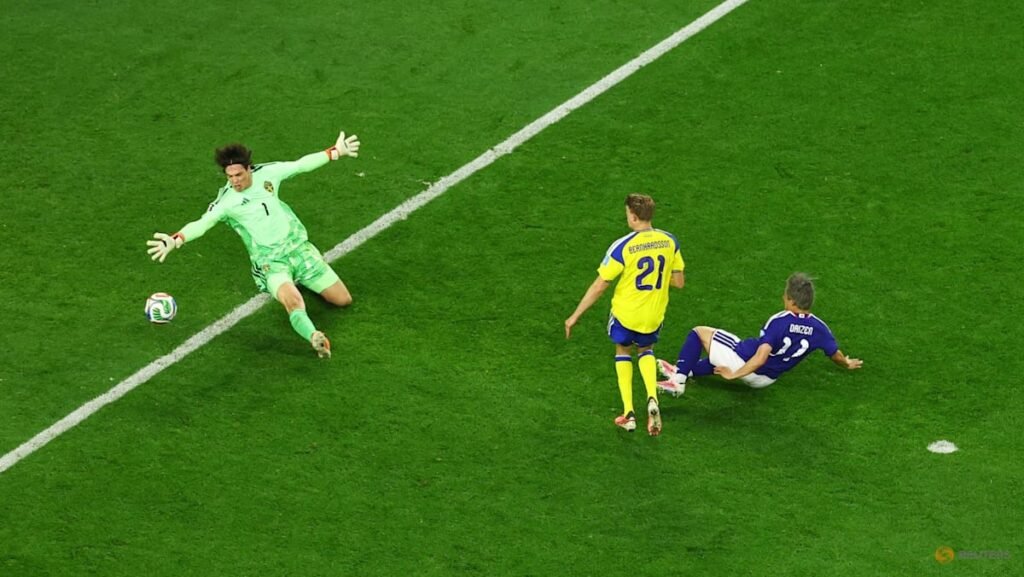Japan through to World Cup last 32 after 1-1 draw with Sweden