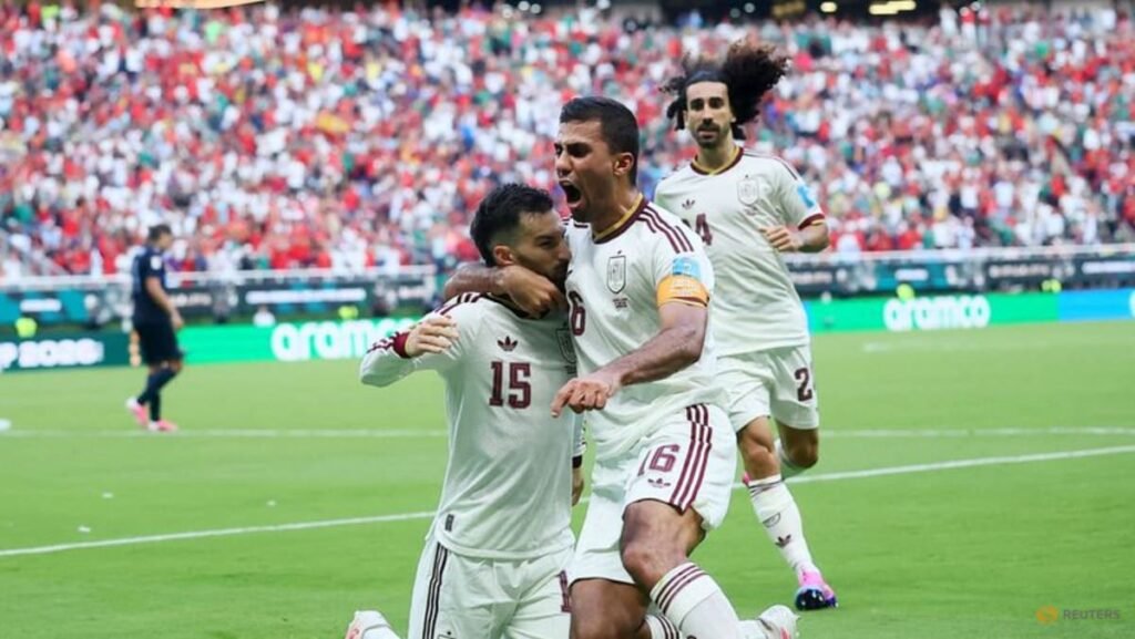 Baena strike sends Spain past Uruguay into World Cup knockouts
