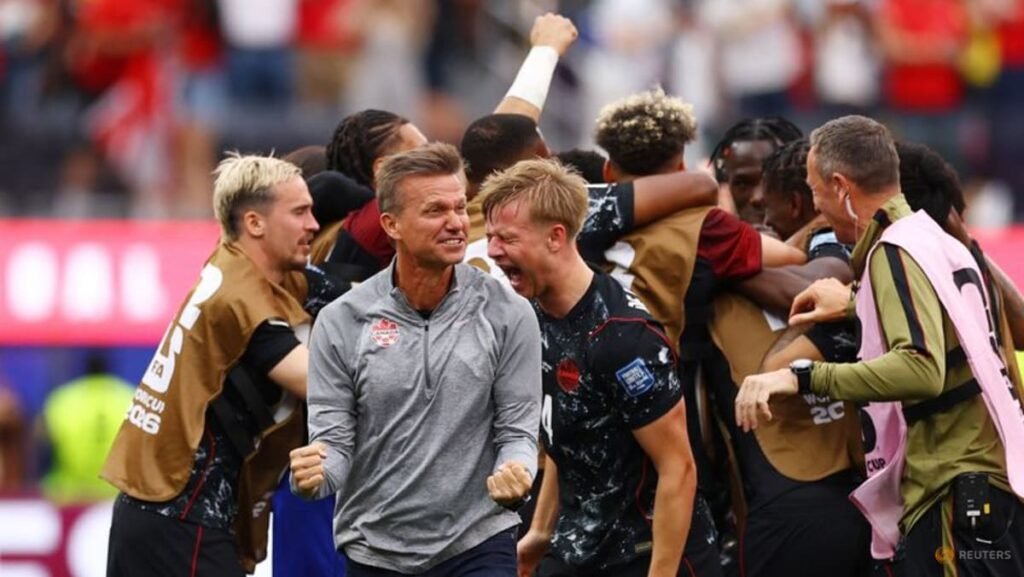 Canada score late winner to advance to last 16 at World Cup