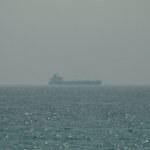 Oil settles up on US-Iran strikes; cautious hopes for shipping cap gains