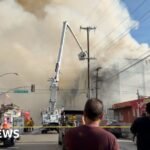 Watch: Massive Los Angeles warehouse fire continues to burn
