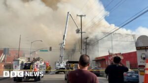 Watch: Massive Los Angeles warehouse fire continues to burn