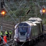 Driver killed in UK train collision passed red signal: investigators