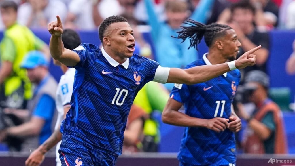 Mbappe double sends France into World Cup knockout rounds after weather delay