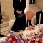 Moment Trump signs US-Iran agreement at Palace of Versailles