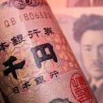 Dollar higher after data as yen holds near 40-year low
