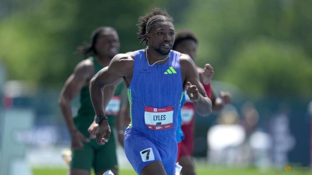 Lyles eases injury fears after cramp halts 200m run