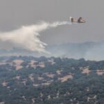 Europe wildfires: Many flee by boat as fires spread, merge