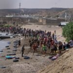 Hundreds of migrants flood into Spain’s Ceuta exclave from Morocco