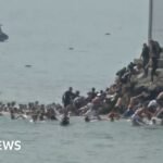 Migrants seen swimming around border fence of Spanish enclave Ceuta