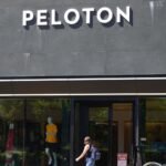 Peloton posts first ever annual net profit, but shares drop as outlook disappoints