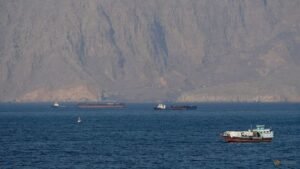 Oil drops, stocks hit records on hopes of Hormuz opening