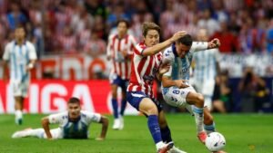 Atletico Madrid beat Malaga but Alvarez absence is felt