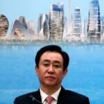 China jails Evergrande founder for life, fines firm more than US$2 billion