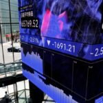 Shares skid in Asia as oil, yields stay high