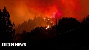 Fast-moving Canada wildfire doubles in size forcing thousands to flee homes