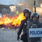Protesters clash with police, set fire to Ceuta migrant camp