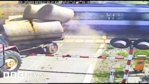 Watch: Moment passenger train crashes with trailer carrying straw bales