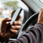MPs raise concerns over mounted devices, private-hire drivers as law passed to criminalise holding phones while driving