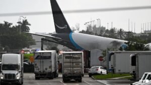 Amazon cargo plane overshoots Miami runway, hits vehicles, catches fire