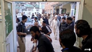 Gunmen target ambulance in Pakistan after suicide bombing at checkpoint killed 12