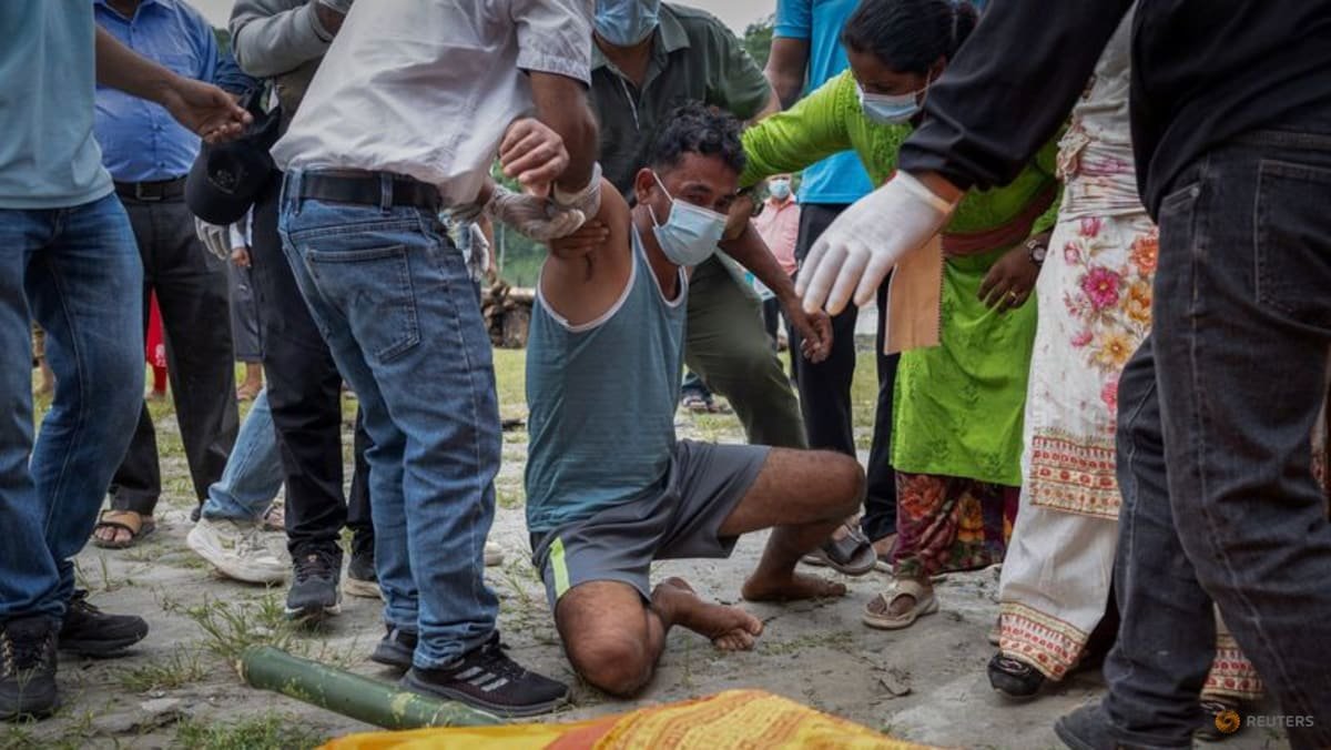 Nepali families hold symbolic funerals for missing after floods