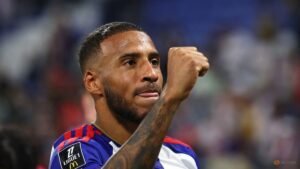 Lyon thrash Rennes 4-0 after delay due to offensive banner