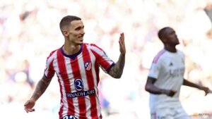 Atletico ride derby storm to beat 10-man Real Madrid 2-1