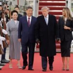 China’s Xi arrives in Washington, kicking off his state visit with rare planeside welcome from Trump