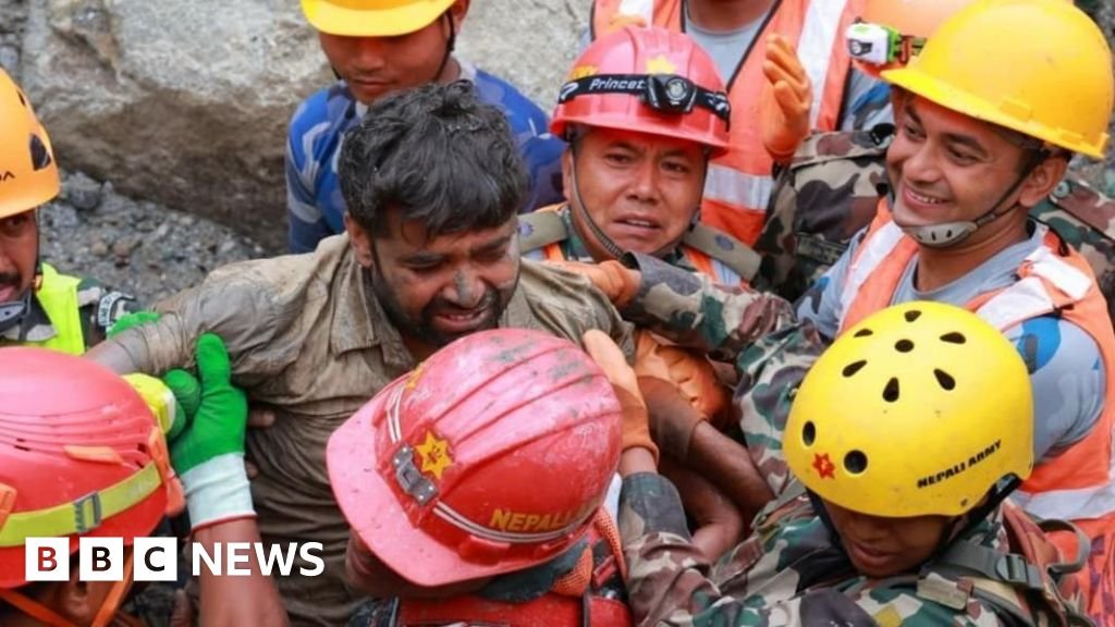 Nepal rescuers try to reach dozens trapped in tunnel after two pulled out alive