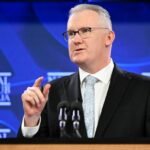Australia to cut student, backpacker visas in migration curb