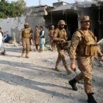 Suicide attack at police checkpoint in northwestern Pakistan kills at least 11