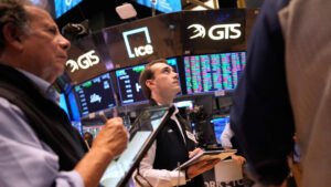 Stocks climb as oil retreats, Fed calms inflation fears
