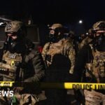 ICE agent charged with lying about shooting Venezuelan man during crackdown