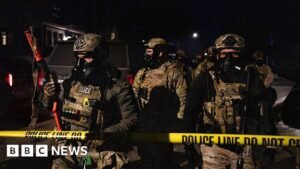 ICE agent charged with lying about shooting Venezuelan man during crackdown