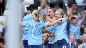 Manchester City beat hapless Arsenal 4-2 to stay top of WSL