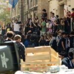 Teenager loses hand picking up grenade in France school protests