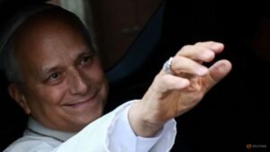 Smiling pope returns to Vatican after cancer surgery