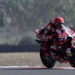 Marquez shrugs off crash to take pole at wet Australian Grand Prix
