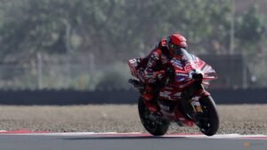 Marquez shrugs off crash to take pole at wet Australian Grand Prix
