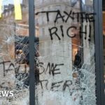 France protests: Burnt out cars and shattered glass on Paris streets after protests turn to riots and looting