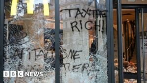 France protests: Burnt out cars and shattered glass on Paris streets after protests turn to riots and looting